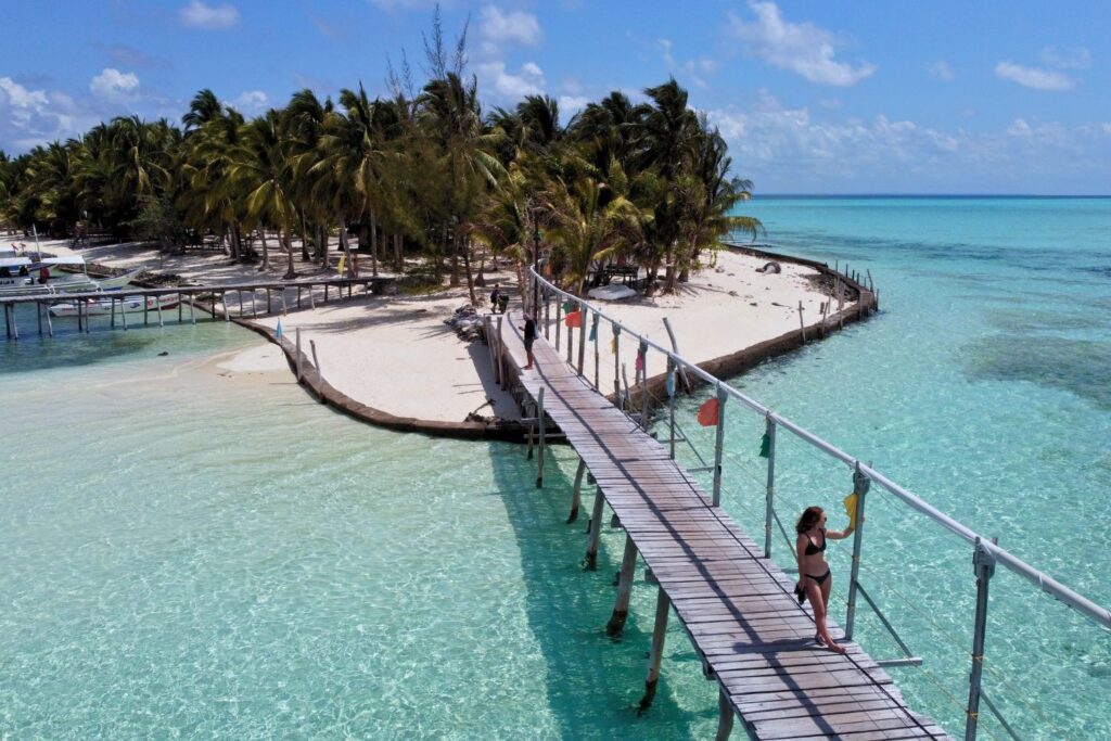 Aerial view of woman on boardwalk on Onok Island, Balabac Palawan