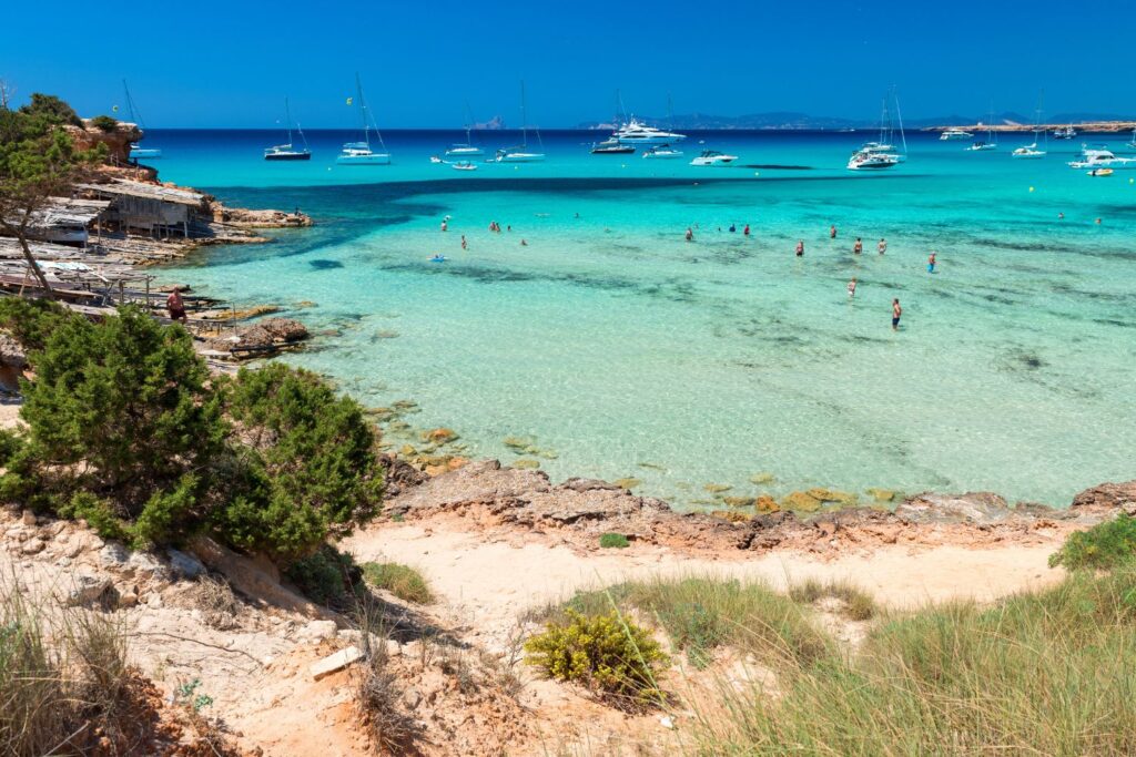 top view of Balearic Beach with crystal clear waters and blue sky