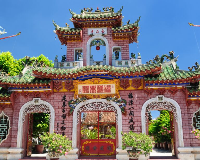 Picture of old temple in Hoi An, Vietnam. Traditional building with trees around.