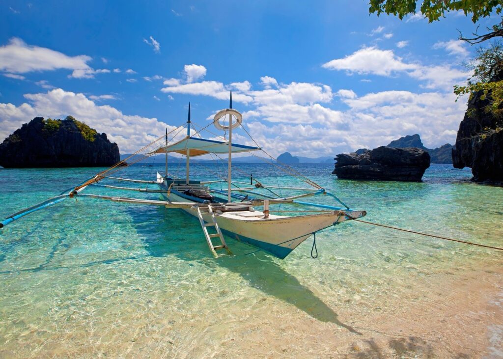 Traditional boat in El Nido Palawan in blue water