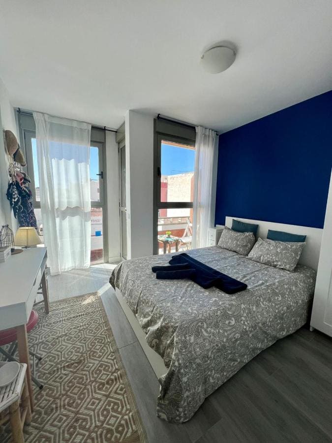 small bedroom with blue and white walls