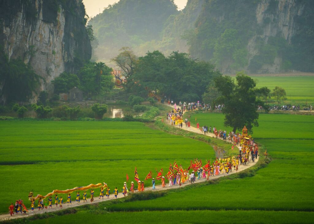 Cultural parade on a misty morning in the mountains of Ninh Binh