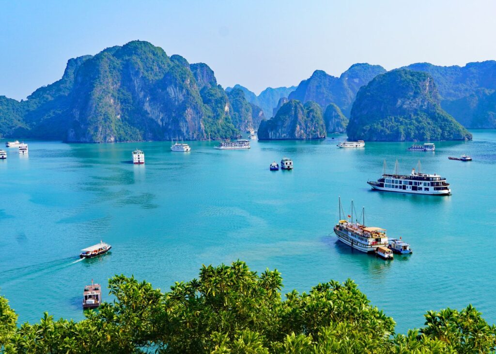 aerial view of Halong Bay Cruise Ships and islands with beautiful rock formations in Vietnam