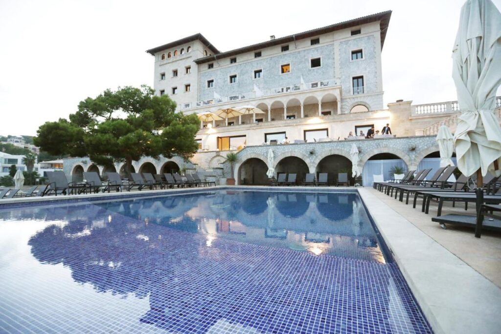 exterior view of the hotel building and outdoor pool