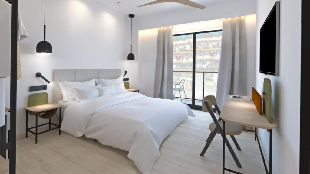hostel bedroom with white interiors and beddings