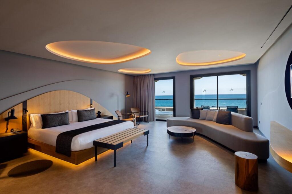 spacious bedroom with stylish interiors and lighting