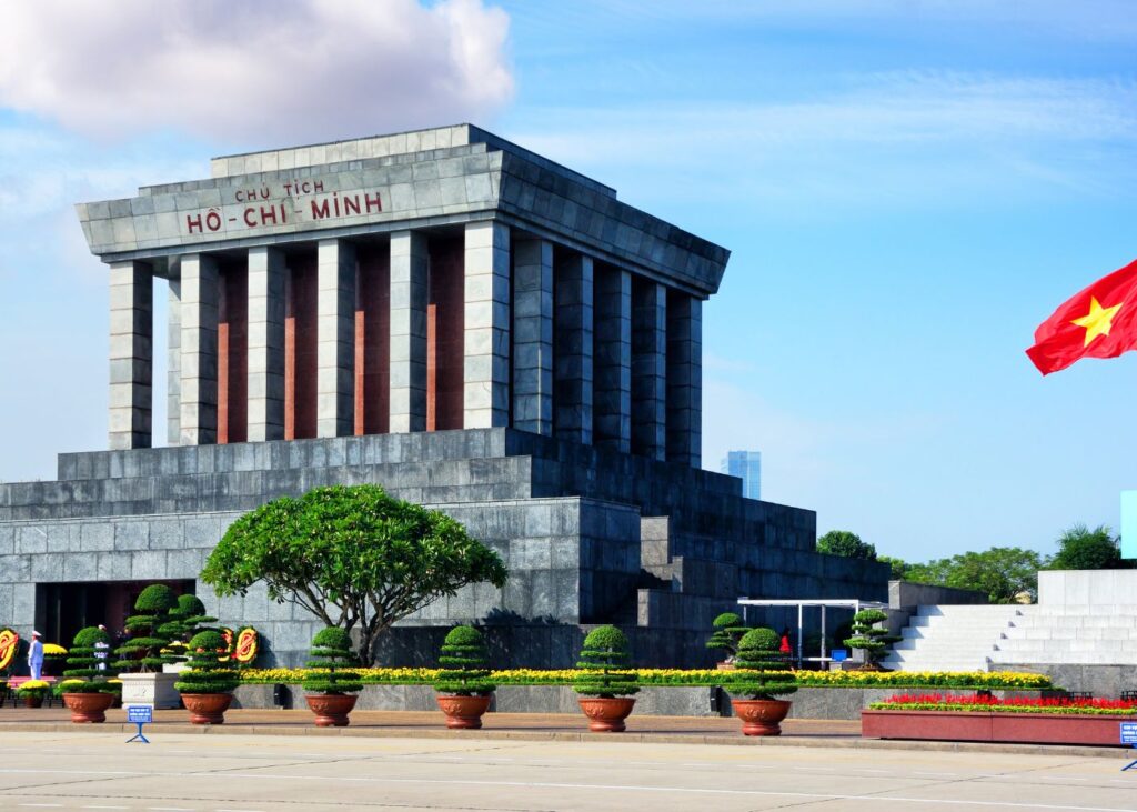 Mausoleum of Ho Chi Minh with Vietnamese flag