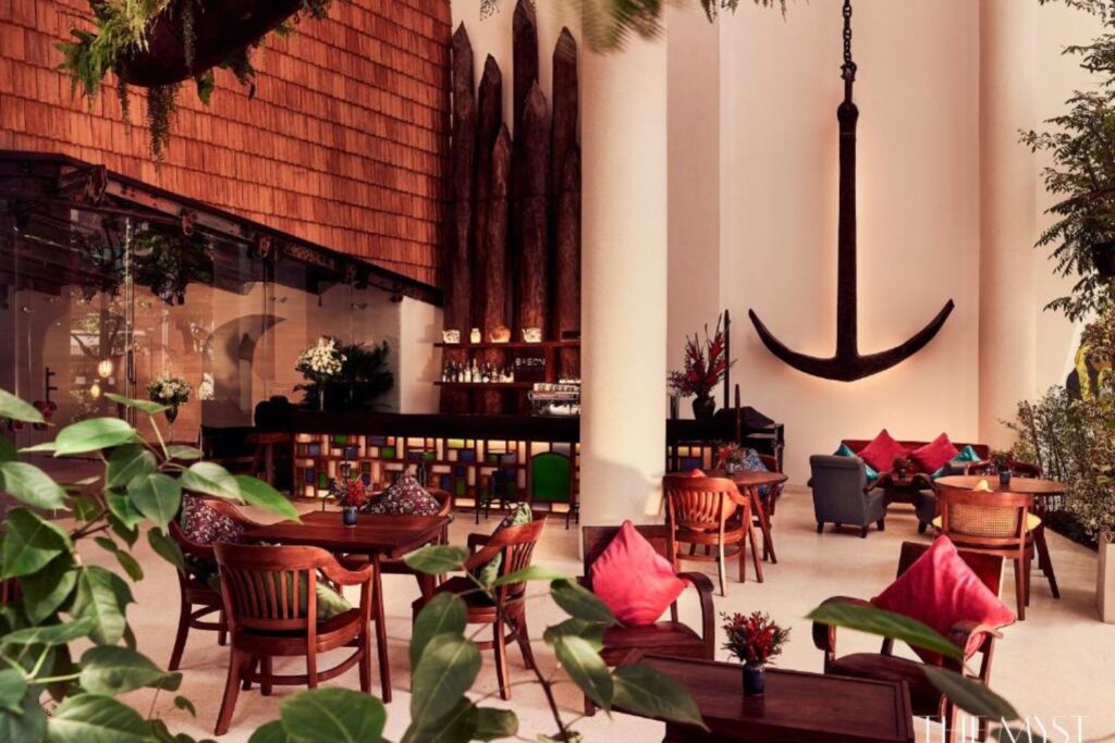 Outdoor dining facility with large anachor and greenery at The Myst Dong Khoi
