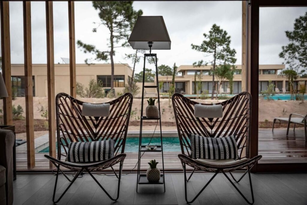 2 industrial chairs and an outdoor pool behind