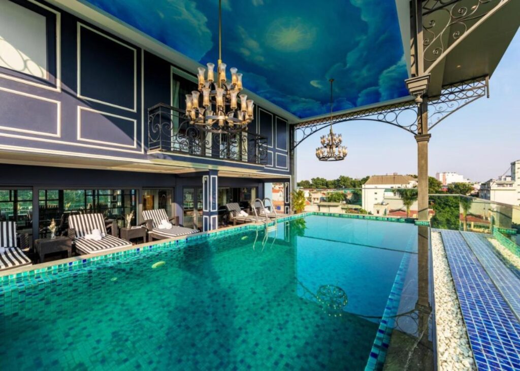 Rooftop pool area with chandeliers at Aria Boutique Hotel and Spa Hanoi
