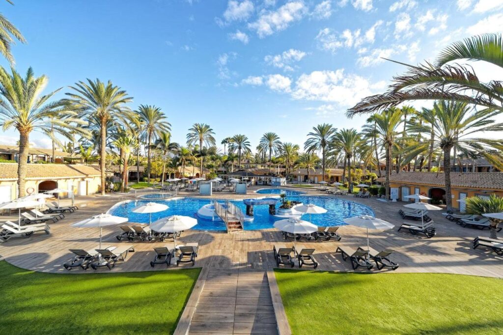 view of the outdoor pool and extensive garden from the hotel