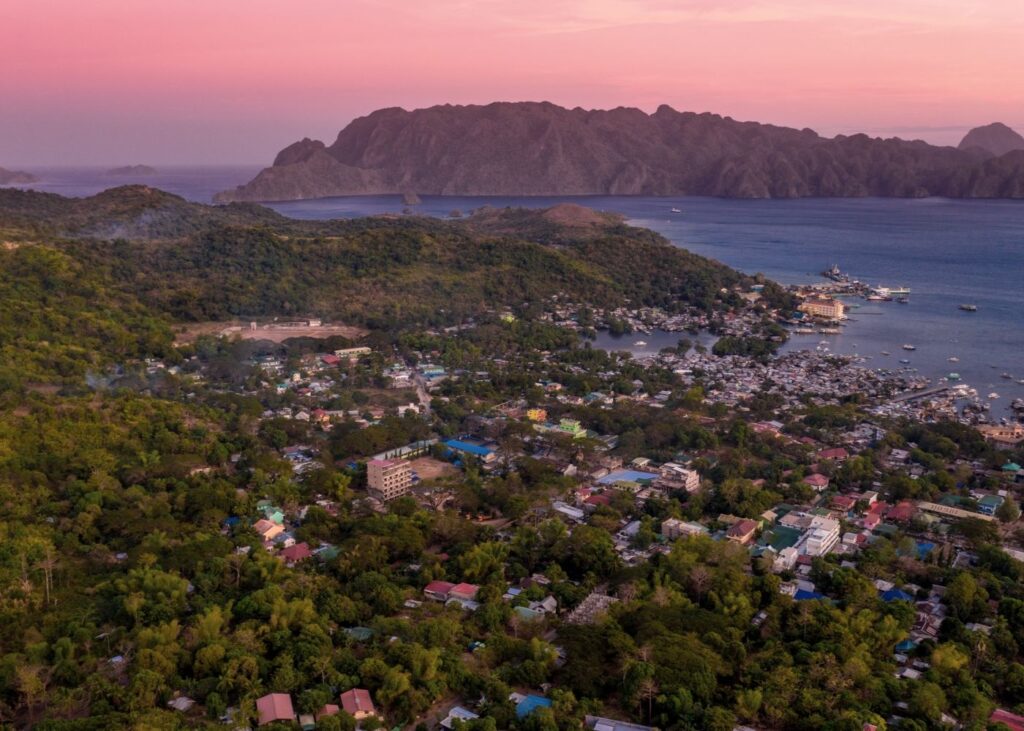 Sunset over Coron Town with mountains in background