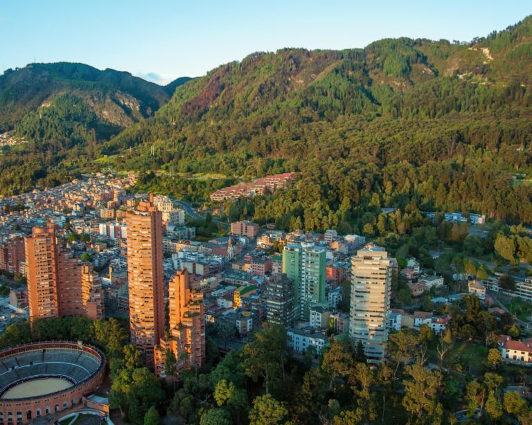 A view of the center of Bogota with the Andes in the background.