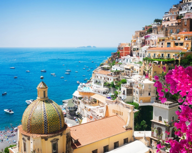View of Positano with flowers - famous old Italian resort in Italy.