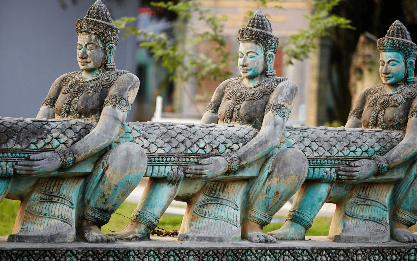 Hindu dieties hold a snake at the Angkor Complex