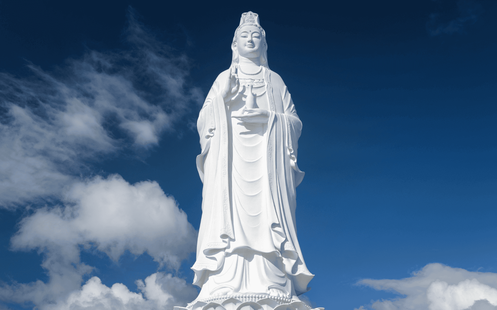 Lady Buddha statue against a blue sky in Da Nang Vietnam, overlooking the Son Tra Peninsula