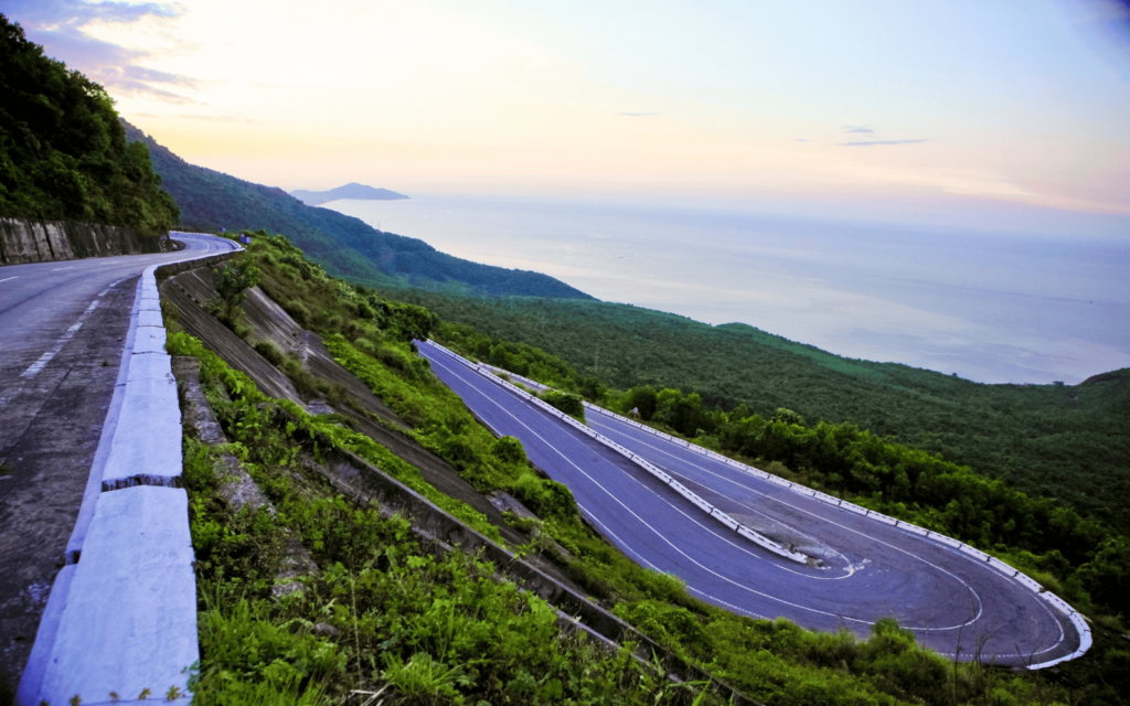 Tight curve with greenery and ocean views on the famous Hai Van Pass near Da Nang Vietnam