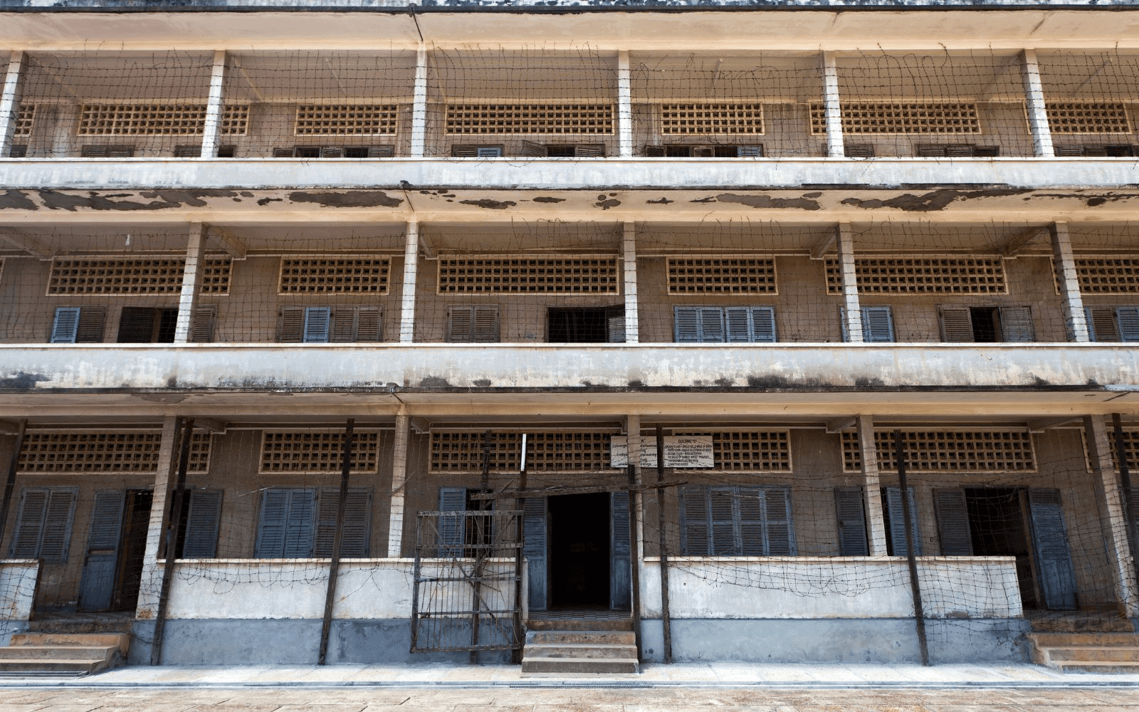 Tuol Sleng, S21, prison camp in Pnohm Penh, bare concrete and blue building