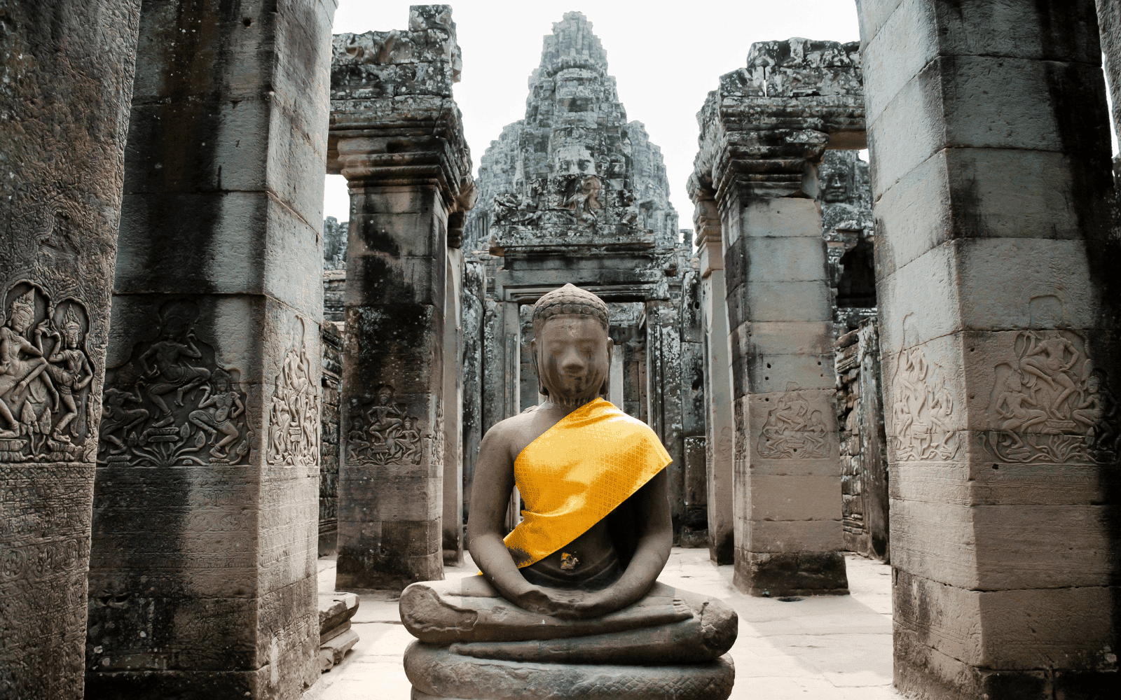 Buddha statue with gold sash in Bayon Temple