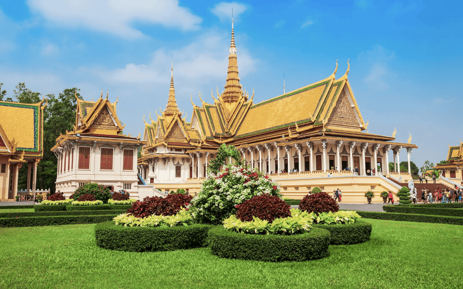 Buddhist architecture and gardens of Phnom Penh on a sunny day wiht blue skies
