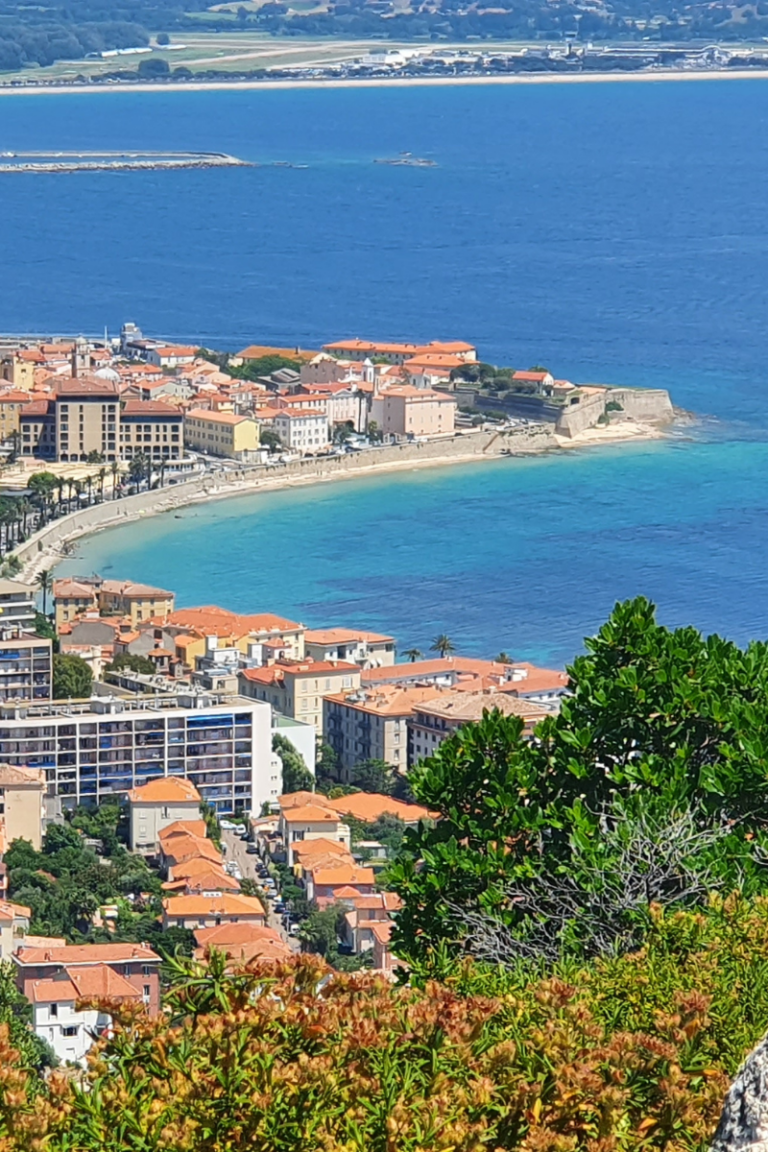 aerial view of the coastline and hotel buildings where to stay in Corsica